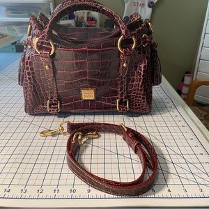 Dooney and Bourke Bordeaux T’moro leather embossed crocodile satchel.